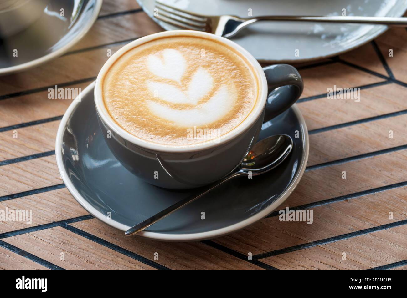 Delicious morning cup of cappuccino in a cafe Stock Photo