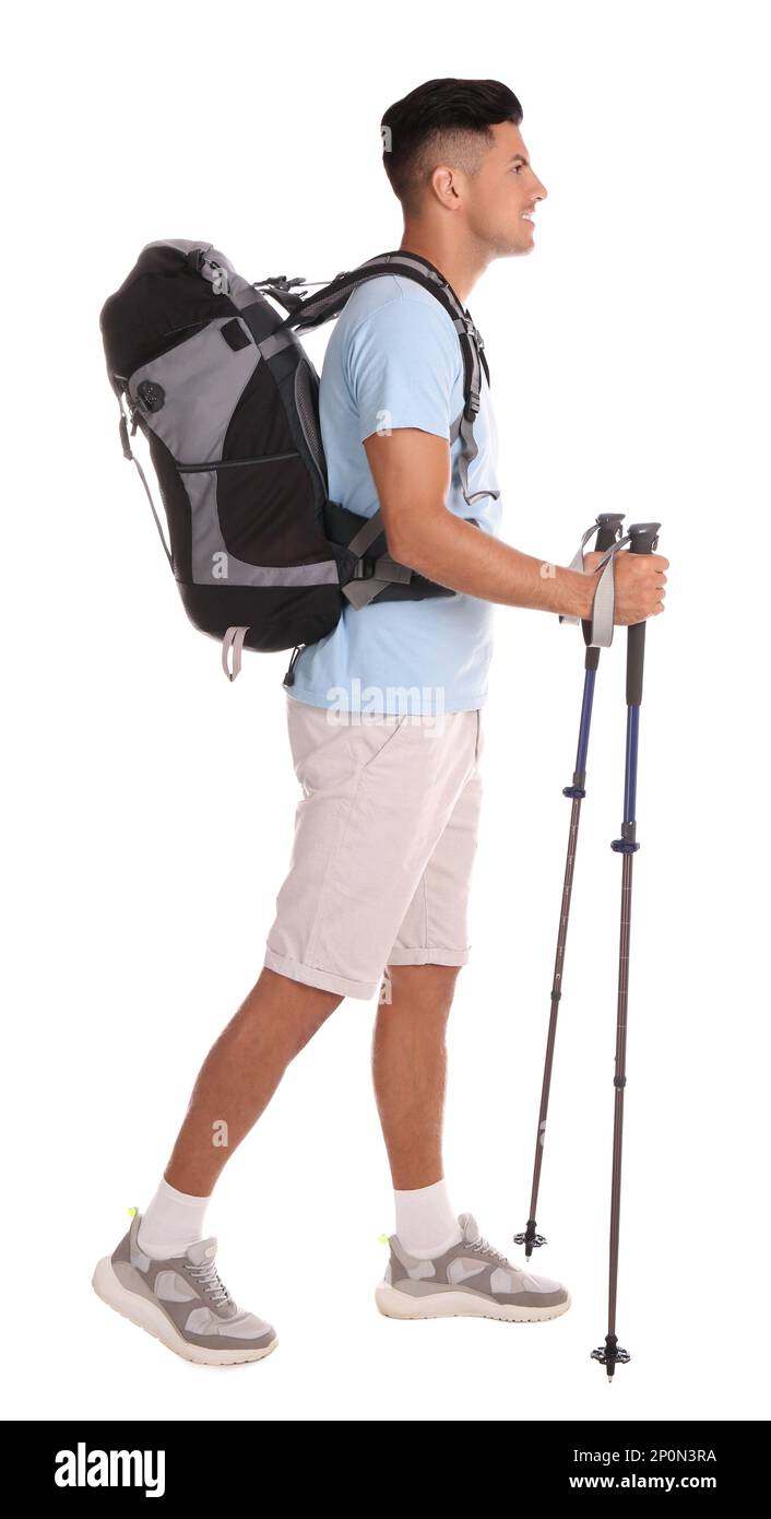 Male hiker with backpack and trekking poles on white background Stock ...