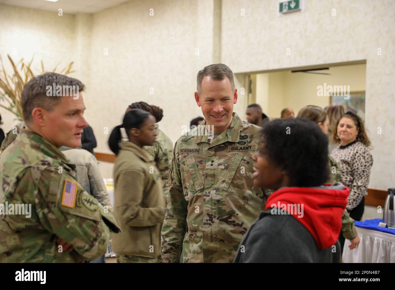Maj. Gen. Todd Wasmund and Col. Matthew Gomlak speak with a Vicenza Community Member prior to the commencement of the Dr. Martin Luther King, Jr. prayer breakfast. The event was an opportunity for Soldiers and civilians to reflect on past injustices King fought during the civil rights movement and highlight diversity in today's Army. Stock Photo