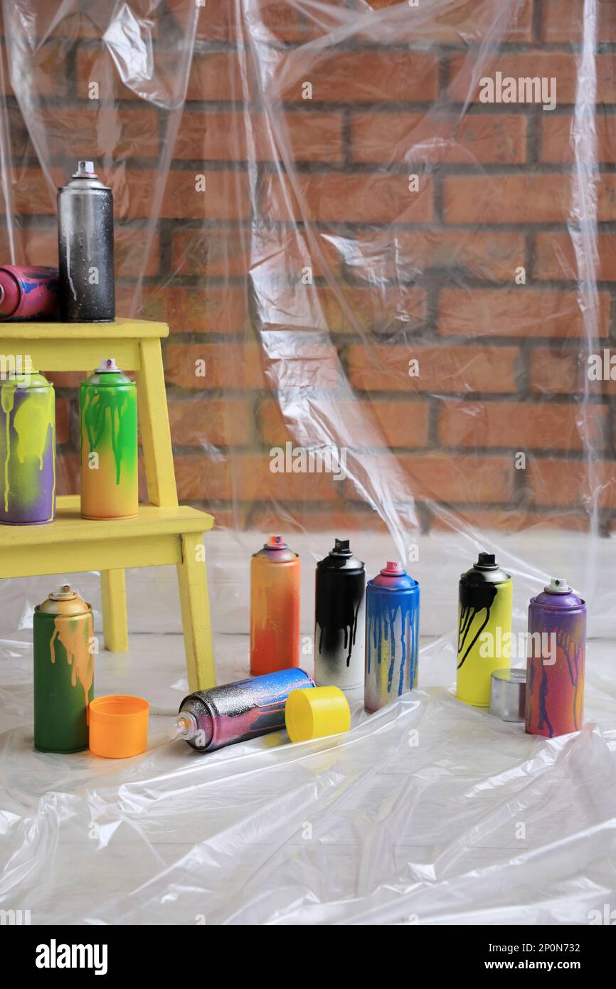 Used cans of spray paints indoors. Graffiti supplies Stock Photo Alamy