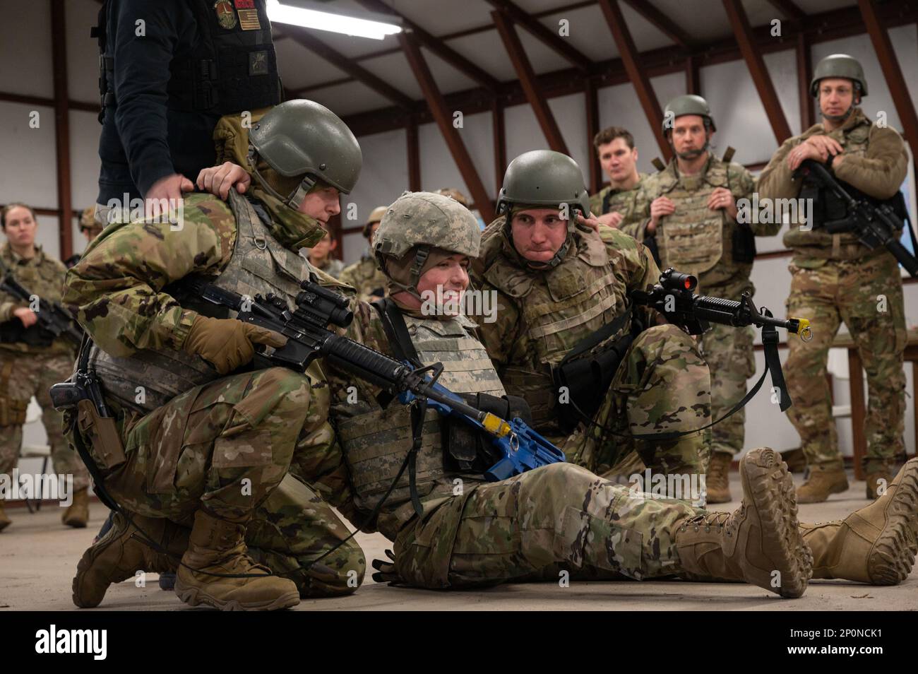 U.S. Air Force Airmen perform buddy carry procedures at the Tactical Combat Casualty Care lane