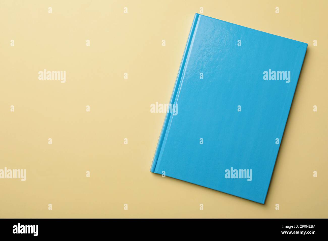 New light blue planner on beige background, top view. Space for text Stock Photo