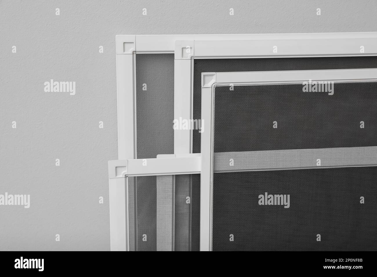 Set of window screens on light grey background, closeup Stock Photo Alamy