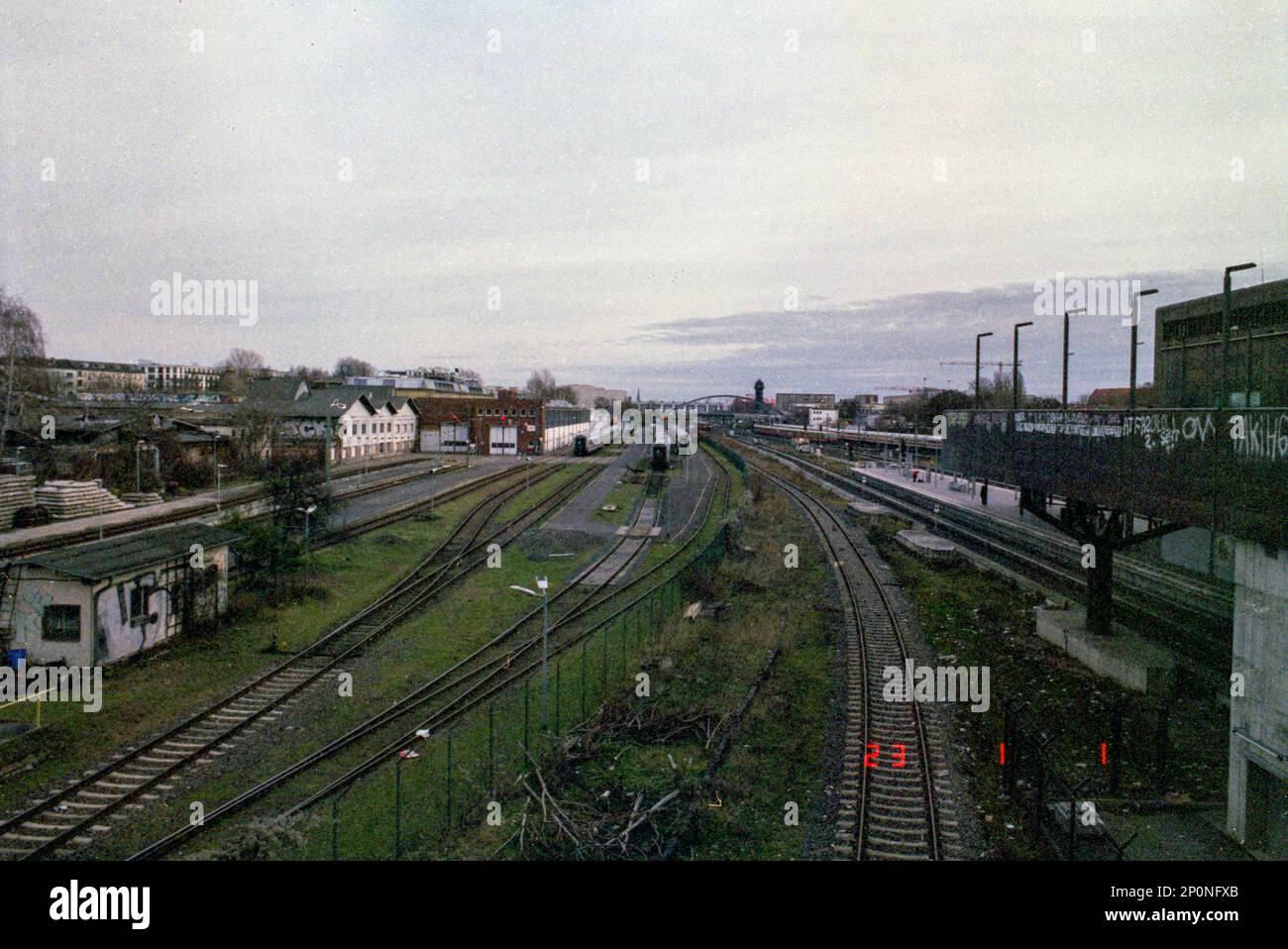 Berlin, Germany. S-Bahn and Train Tracks in between Warschauer Strasse S-Bahn and RAW Gelande and the former Reichsbahn Werke. Stock Photo