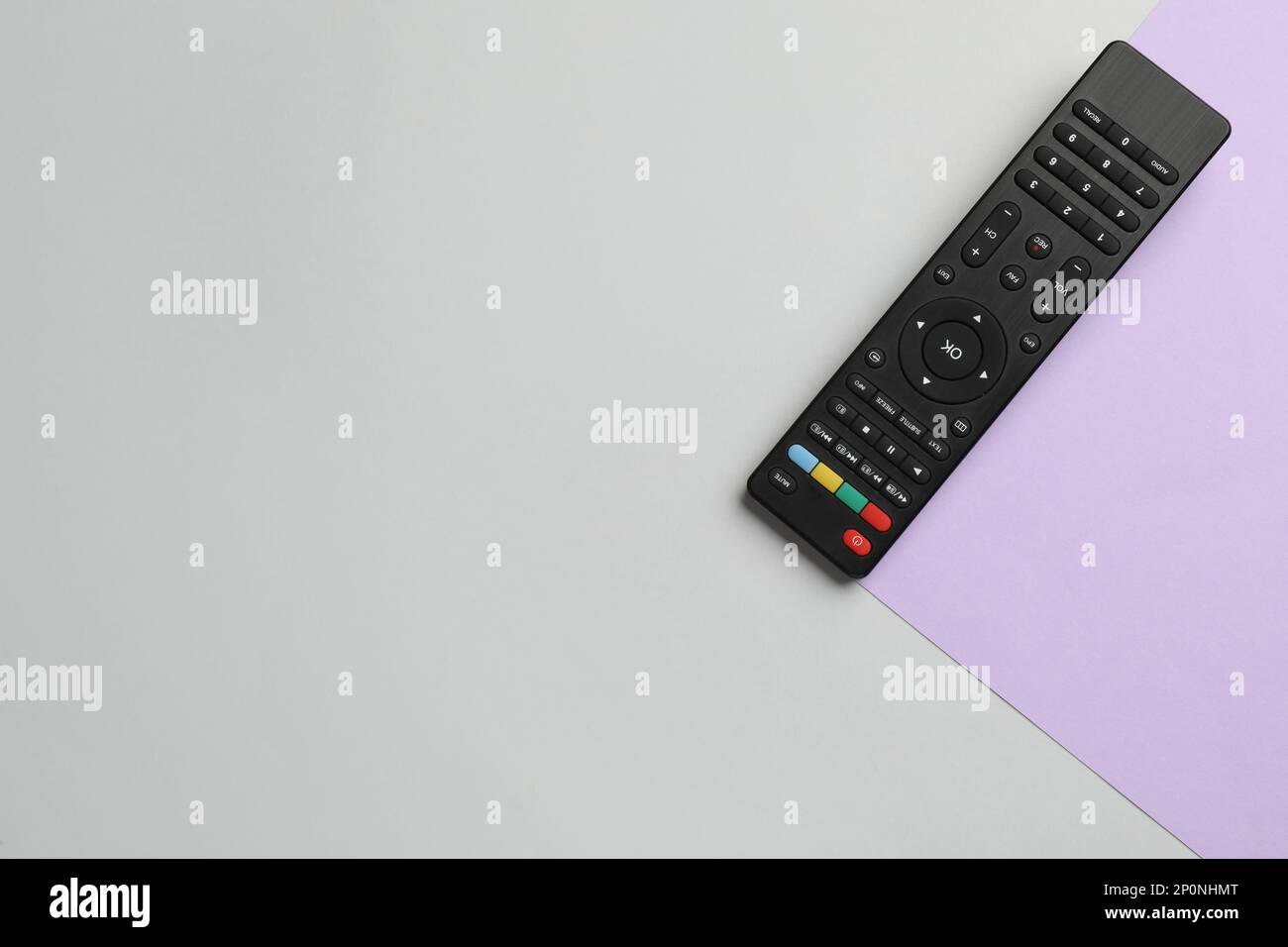 Modern tv remote control on color background, top view. Space for text ...