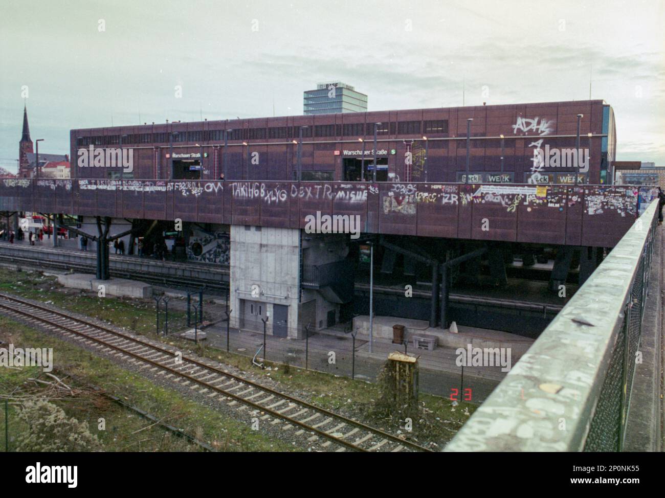 Berlin, Germany. View on Warschauer Strasse S-Bahn Station Kreutzberg alongside a Train and S-Bahn Track. Stock Photo