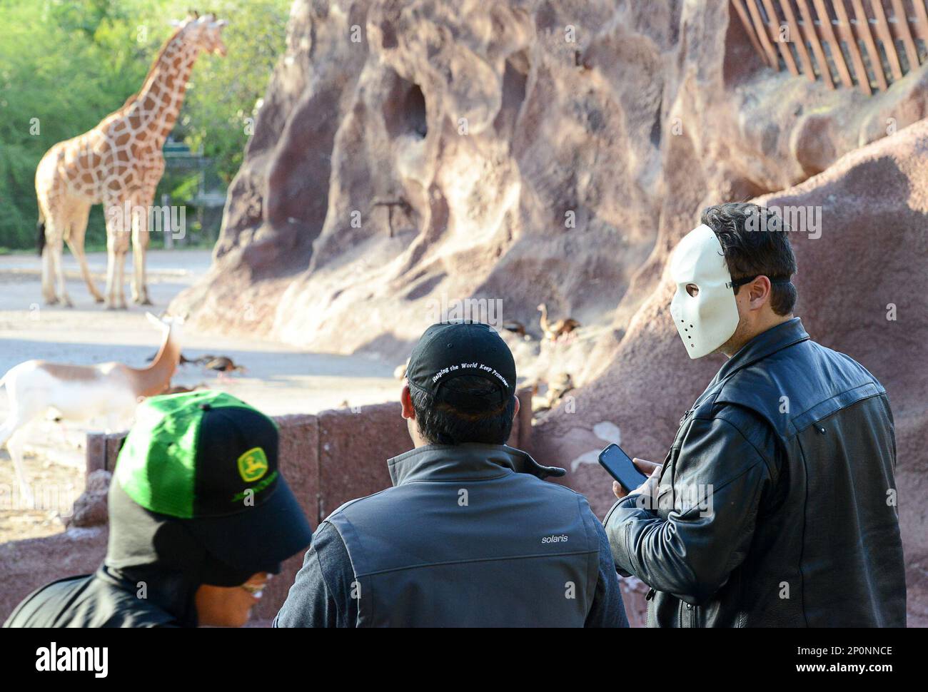 Dillon McCameron, far right, speaks to his friend after photographing