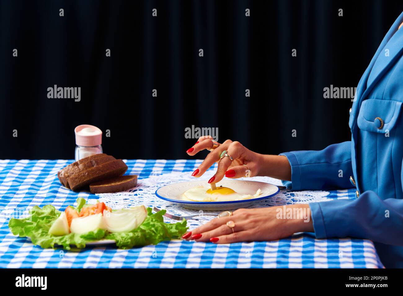 eating eggs like smoking cigarettes Cigarette butt and fried egg Stock Photo