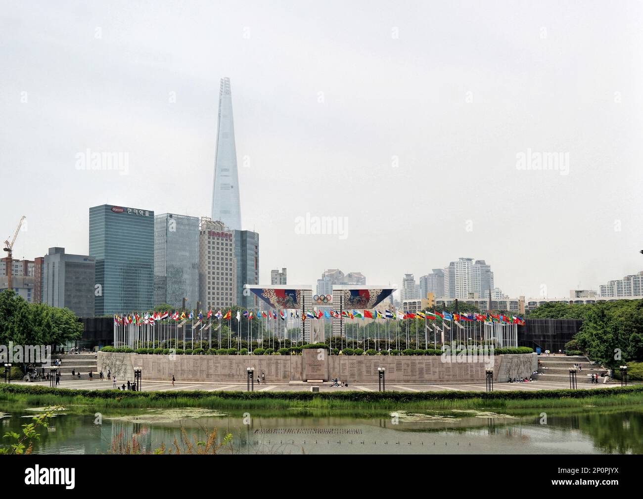 Seoul, South Korea - May 2019: Panoramic view of Olympic Park with World Peace Gate against high rise buildings and Lotte World Tower Stock Photo