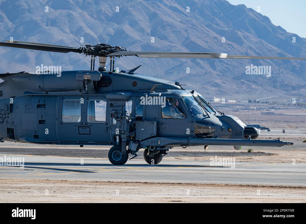 An HH-60W Jolly Green II helicopter from the 66th Rescue Squadron taxis ...
