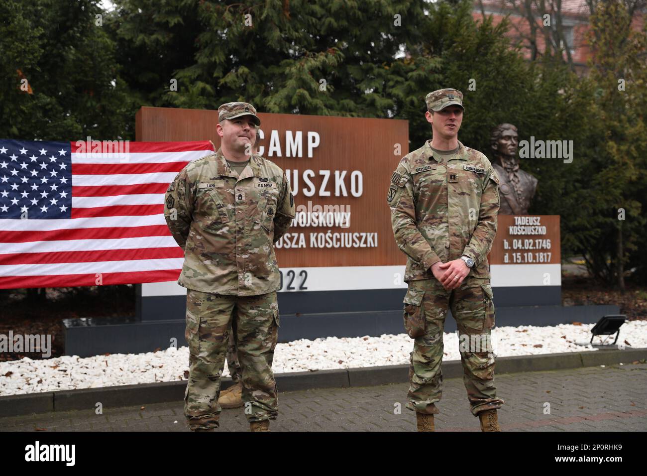 U.S. Army Capt. Alexander Bosco, commander, Alpha Company, 303rd Military Intelligence Battalion, 504th Military Intelligence Brigade, speaks about Sgt. First Class Kenneth Lane, during a reenlistment ceremony, at Camp Kosciuszko, Poznan, Poland, Jan. 9, 2023. III Armored Corps is the world's premier mounted force, highly lethal, trained and ready to conduct sustained, expeditionary, operational maneuver anywhere in the world. Stock Photo