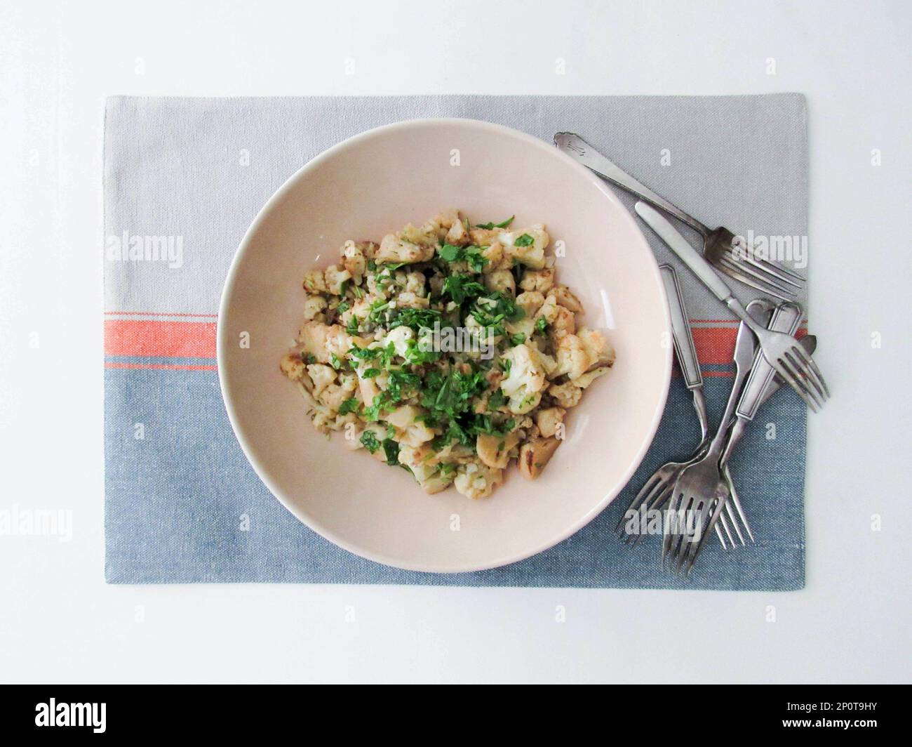 This September 2016 photo shows braised cauliflower with anchovies and