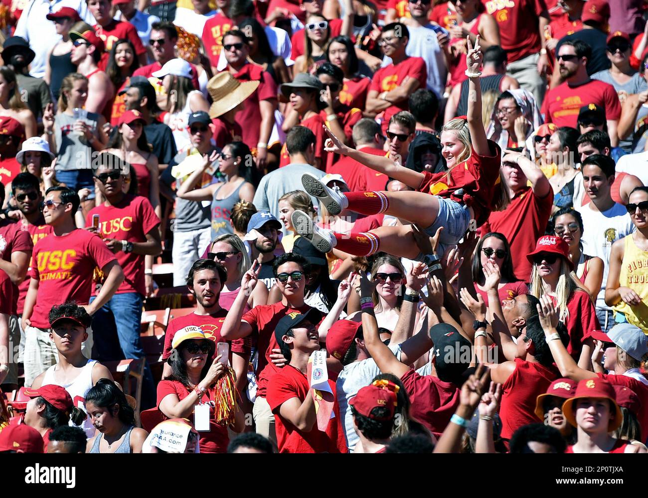 LOS ANGELES, CA - OCTOBER 08: USC student fans lift up a female student ...