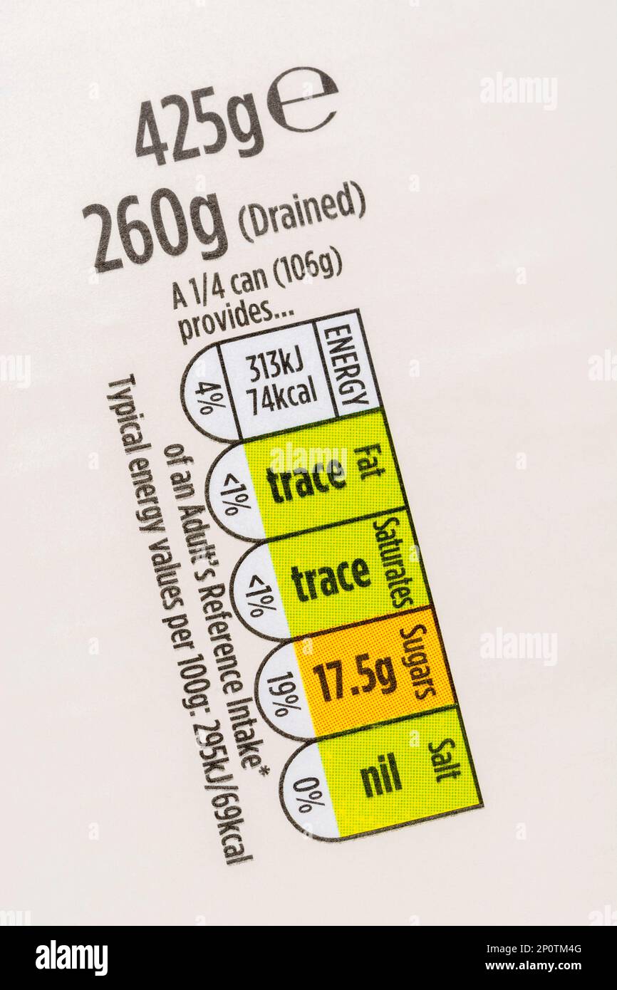 Food nutrition traffic-lights strip on paper label of Morrison's own label tinned pineapple. For UK food dietary information & nutritional labelling. Stock Photo
