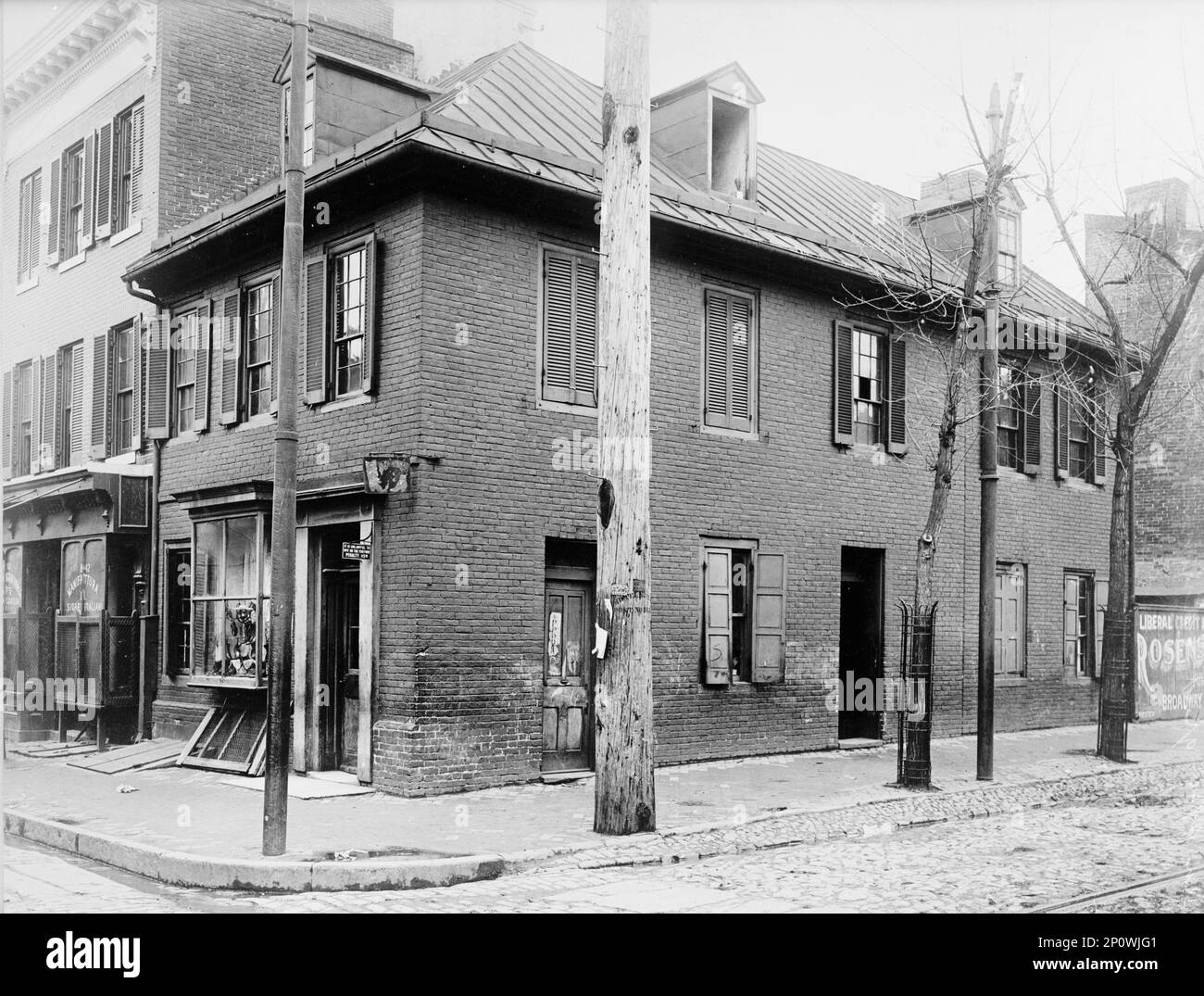 Flags - House Where American Flag Was Made, 1914. Sign: 'It is Unlawful to Spit on the Footway - Penalty $5.00'. The Star-Spangled Banner Flag House in Baltimore, constructed in the late 1700s. Mary Pickersgill, her daughter, and her nieces created a flag sewing business out of their home. Stock Photo