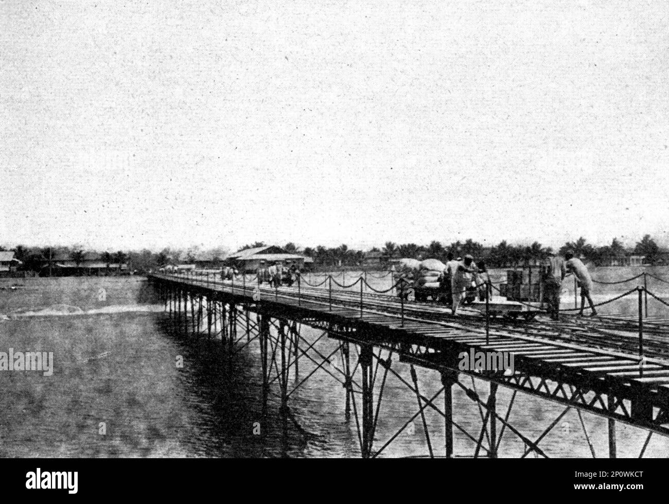 ''Grand Bassam. Le wharf; L'Ouest Africain', 1914. From &quot;Grande Geographie Bong Illustree&quot;, 1914. Stock Photo