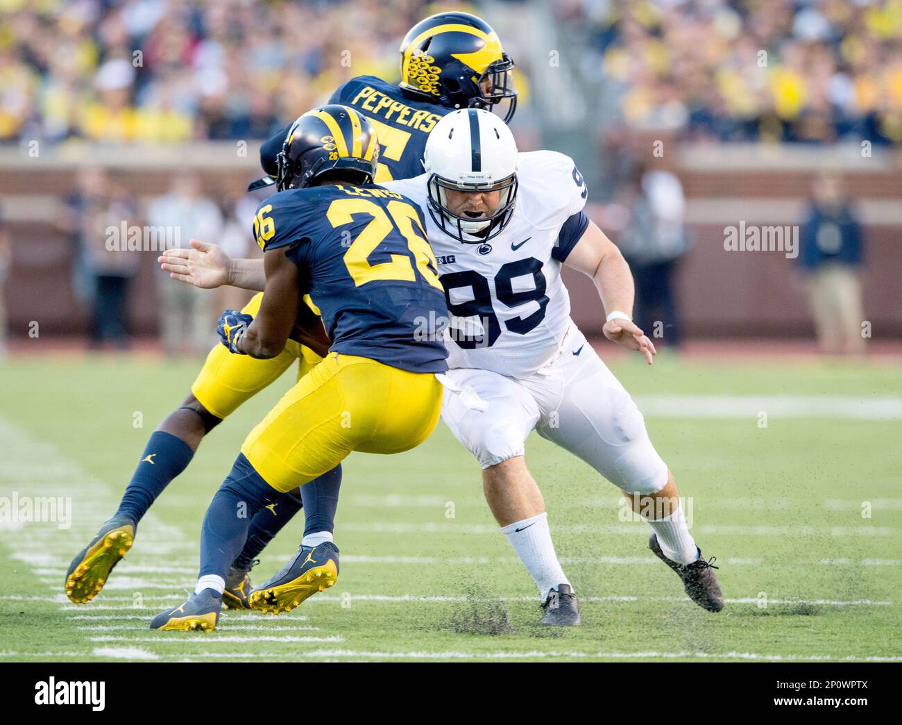 Penn State kicker Joey Julius stops Michigan cornerback Jourdan Lewis on the kick off return