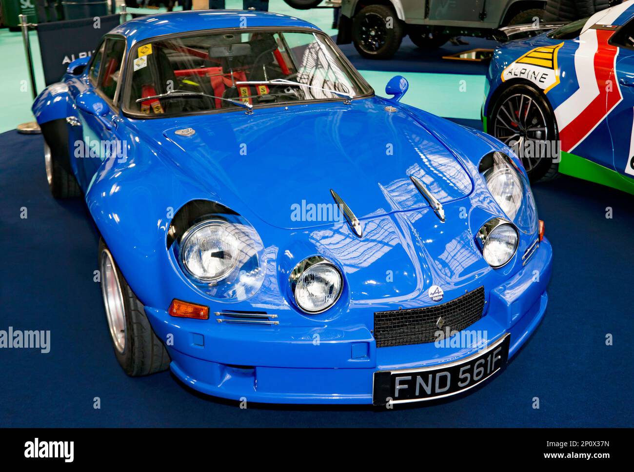 Three-quarters front view of a Blue, 1967, Renault Alpine A110, on display at the 2023 London Classic Car Show Stock Photo