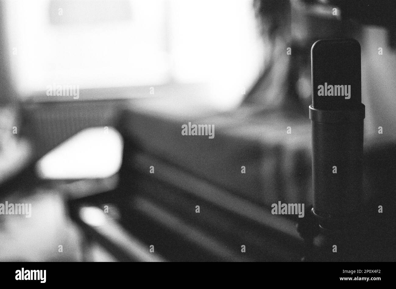 Recording piano and vocals in home studio. Stock Photo