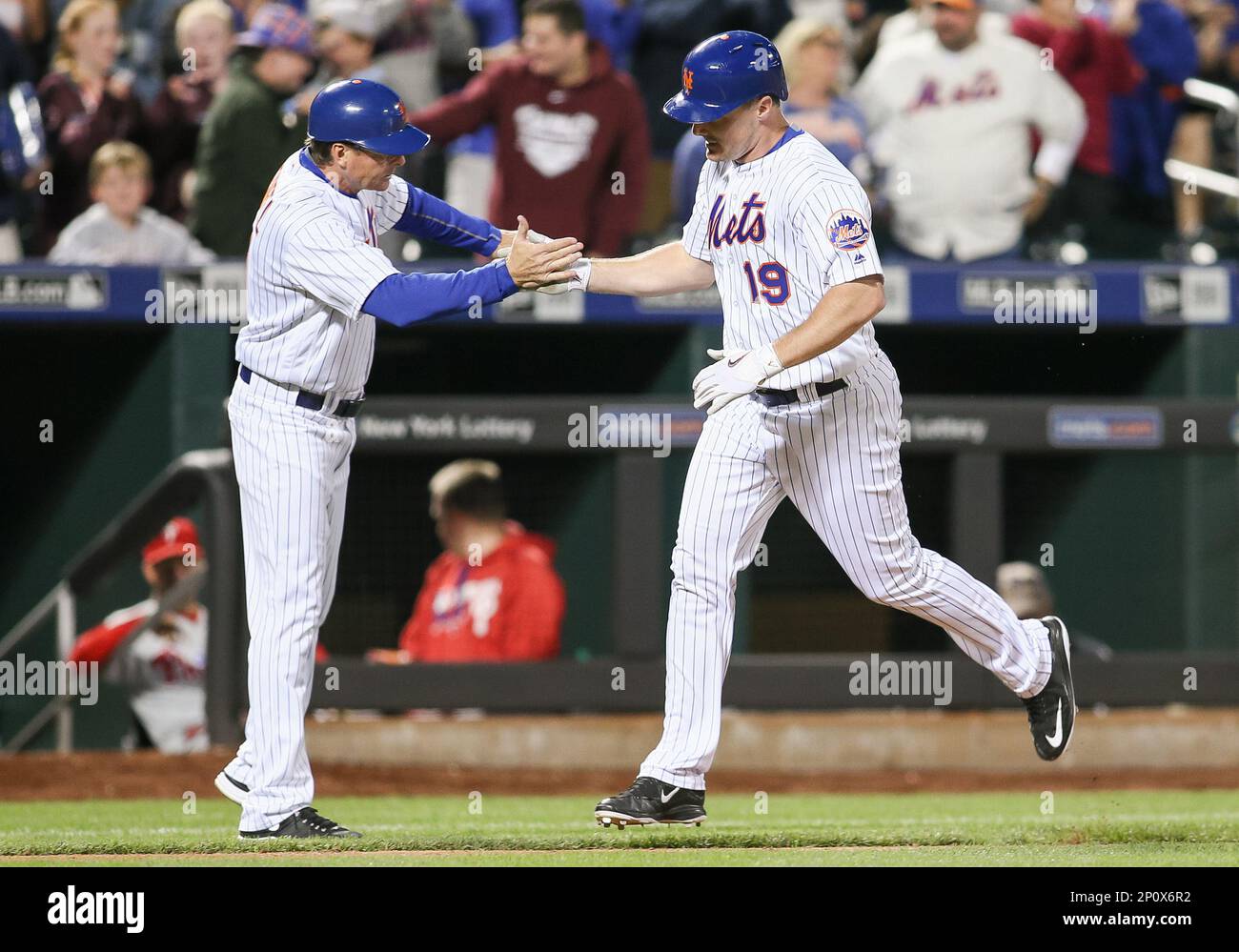 September 24, 2016: New York Mets Right field Jay Bruce (19) [5420] slaps  hands with New York Mets Third Base Coach Tim Teufel (11) as he rounds the  bases after homering during