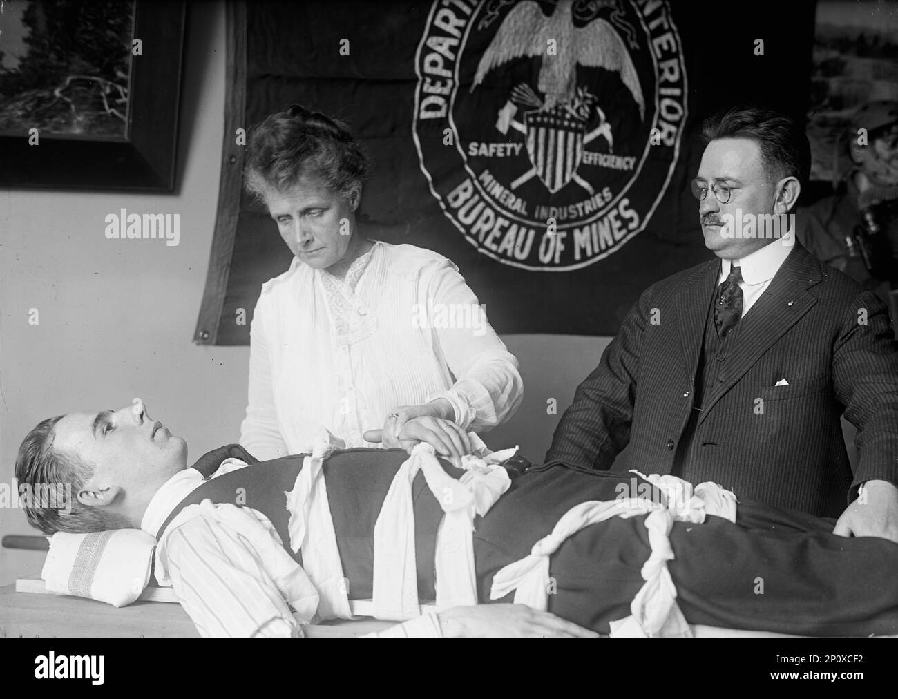Mrs. Van H. Manning, U.S. Bureau of Mines, Left, Mine Rescue Methods, 1917. Mary Z. Manning, widow of Vannoy Hartrog Manning, demonstrates treatment of injured miner. Stock Photo