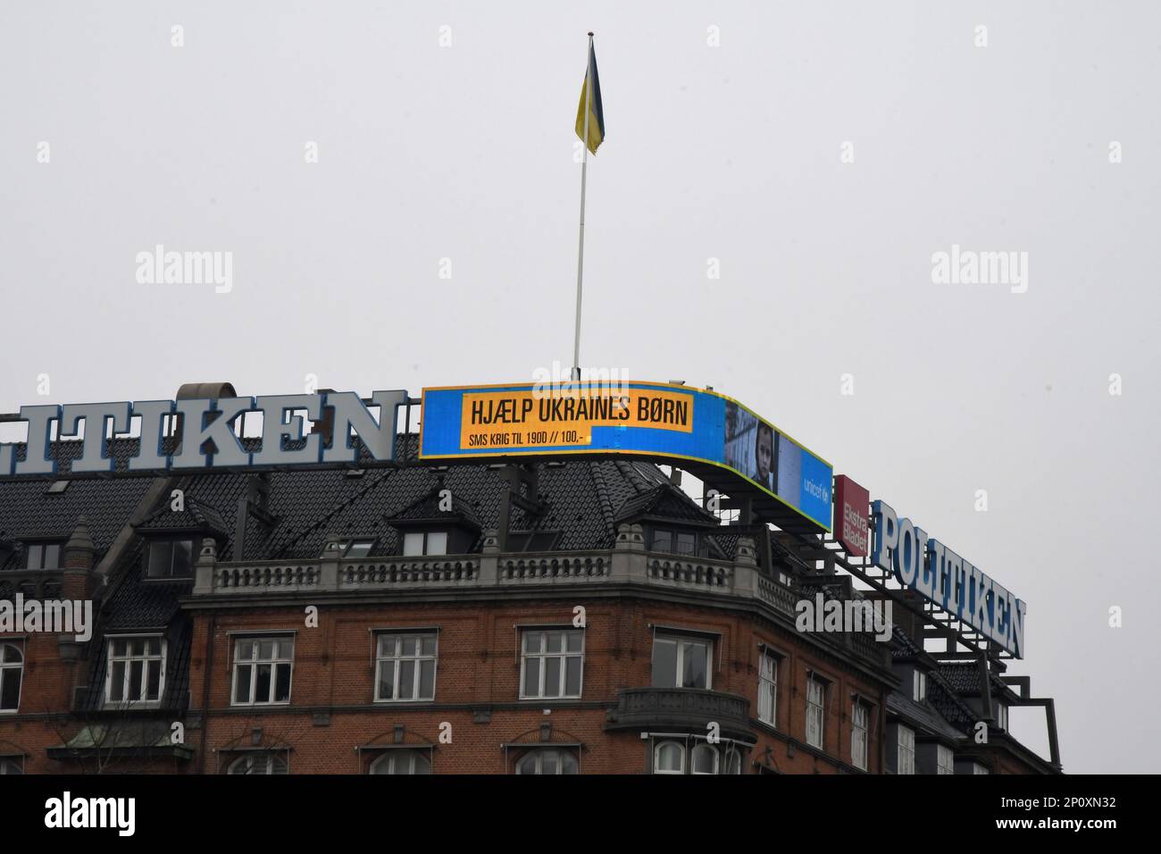Copenhagen/Denmark/03 march 2023/ Danish media Politken hus fly ukrianian flag and neon sign one year Ukrian in war and help ukrianina children ..  (Photo. Francis Joseph Dean/Dean Pictures) Stock Photo