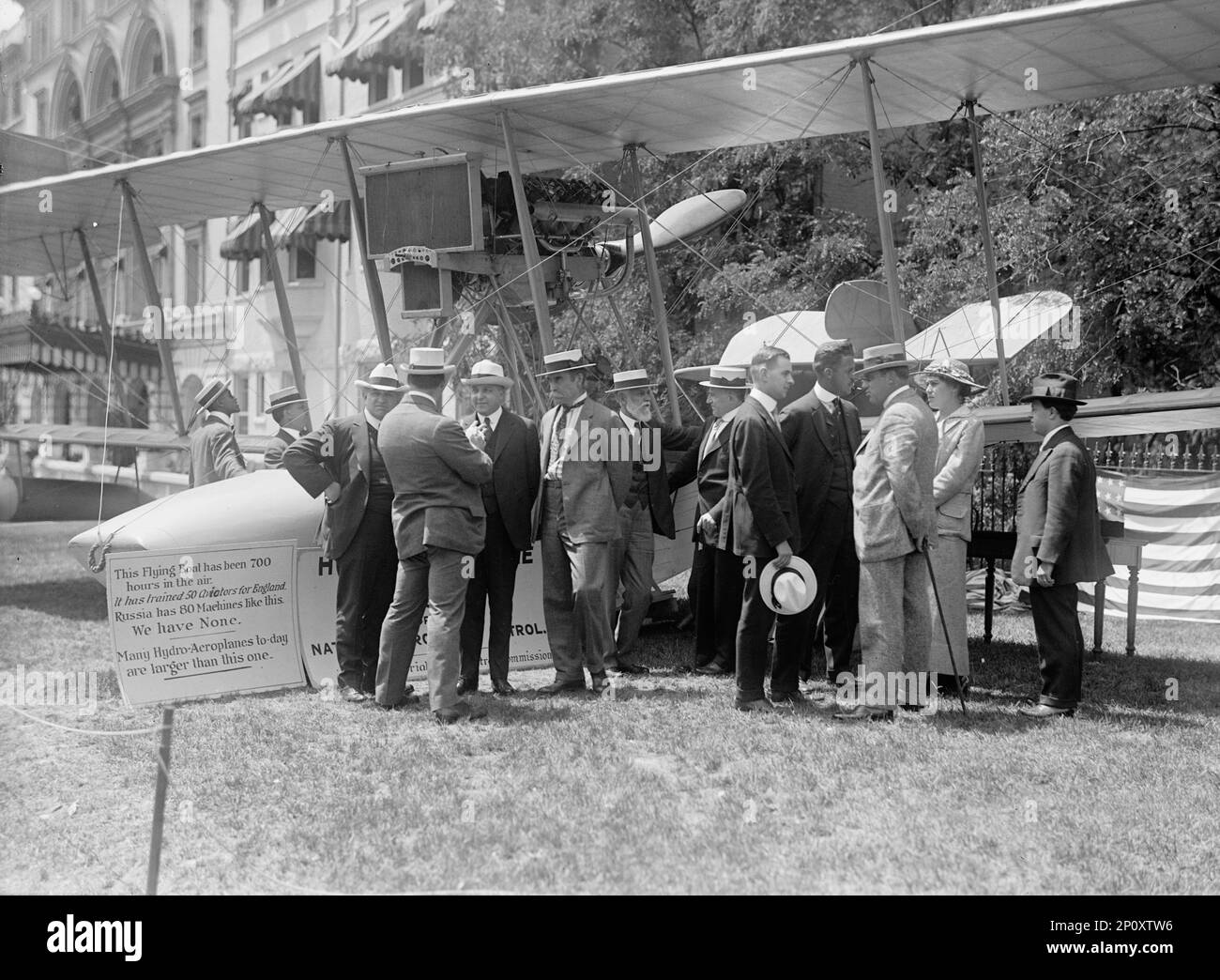 National Aero Coast Patrol Commn. - Curtiss Hydroaeroplane or Flying Boat Exhibited Near House Office Building, Rep. Kahn; Unidentified Back; Asst. Sec. Ingraham; Adm. [Robert] Peary [4th left, foreground]; Rep. Lieb; Prof. Frankenfield; Bowman; Taylor; Newton; Miss Marie Peary; E.H. Smith, 1917. Stock Photo