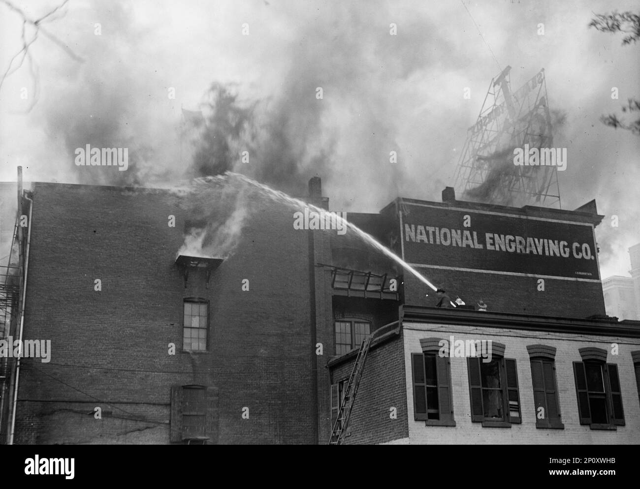 National Engraving Co. Washington, D.C. - Fire, 1917. Firefighters with hose. Stock Photo