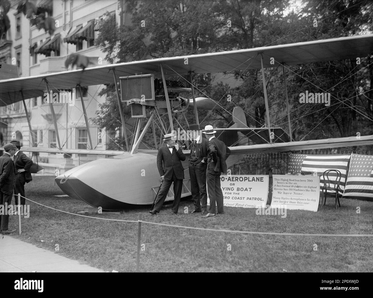 National Aero Coast Patrol Commission - Curtiss Hydroaeroplane or Flying Boat Exhibited Near House Office Building, Frankenfield; Rep. Curry; Bowman, 1917.Signs: 'Hydro-Aeroplane or Flying Boat for the National Aero Coast Patrol - National Aerial Coast Patrol Commission. This Flying Boat has been 700 hours in the Air. It has trained 50 Aviators for England. Russia has 80 Machines like this. We have None. Many Hydro-Aeroplanes to-day are larger than this one'. Stock Photo
