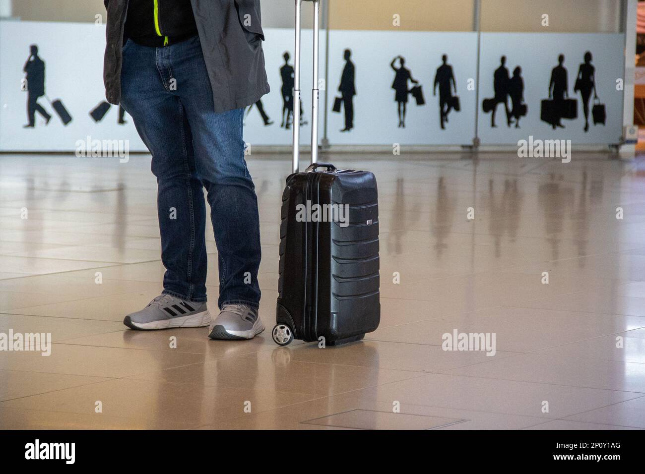 Passenger with carryon luggage at Koln/Bonn Airport Stock Photo Alamy