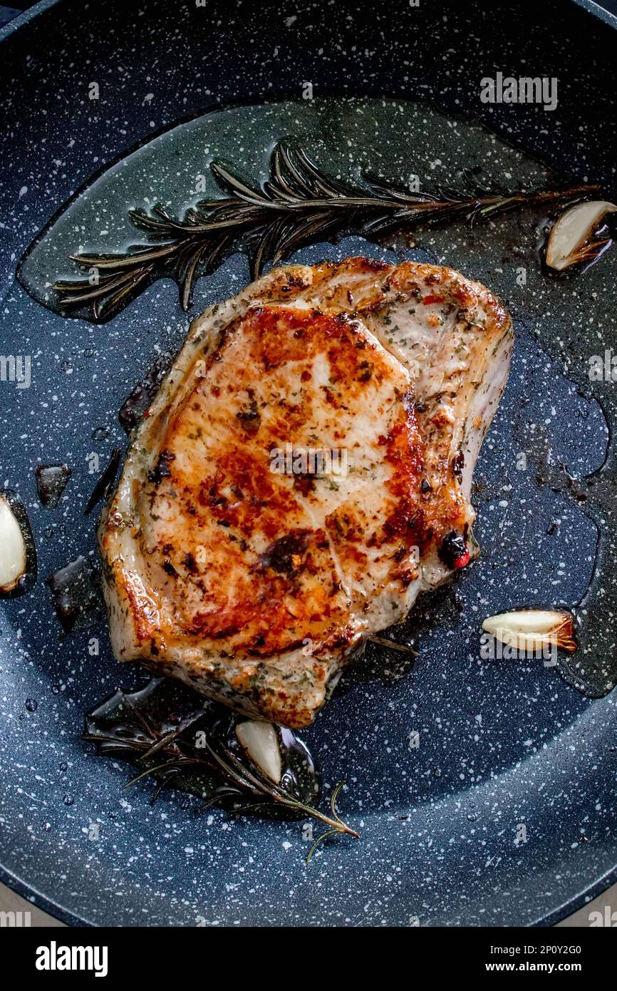 Grilled premium rib eye beef steak in the pan, cooking steak in the