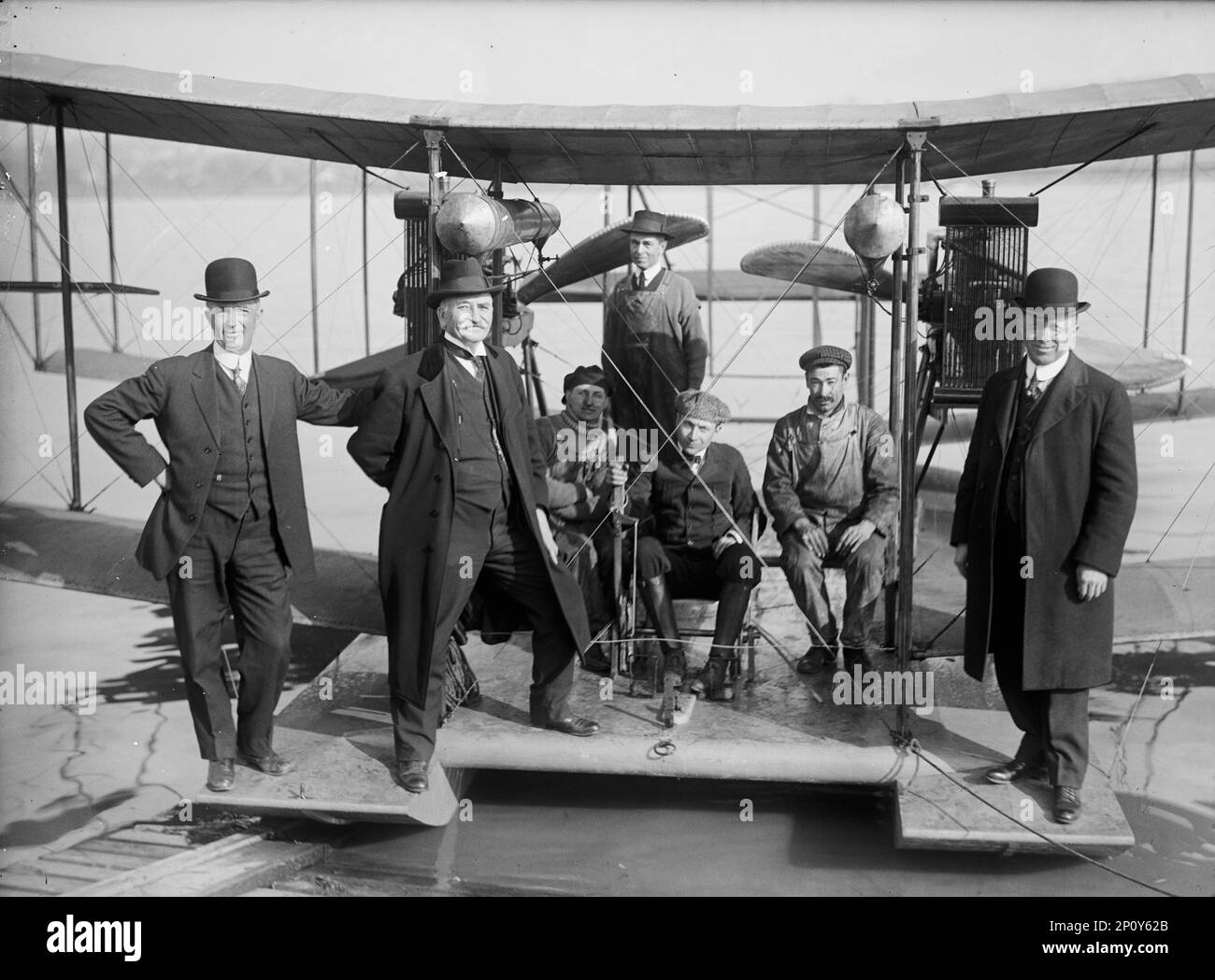 Richardson Tandem Biplane Hydroplane on Potomac, April, 1916. George A. Gray at Controls, at Left And Right are Richardson Brothers who built the plane; 2nd from Left is their uncle, whose idea it was, 1916 April. Stock Photo
