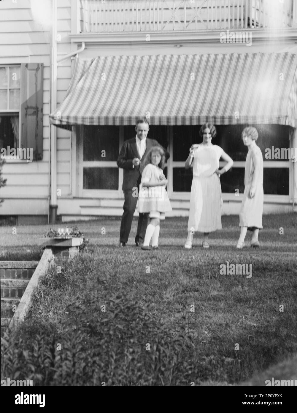Dunning family, standing outside house, 1925 July 9 Stock Photo - Alamy