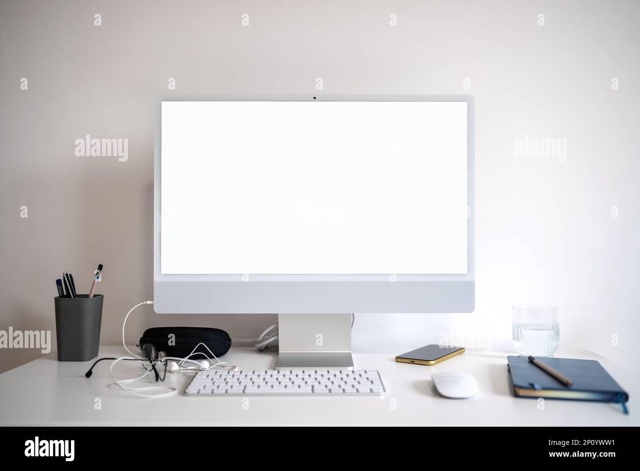 Computer monitor with blank screen on desk Stock Photo - Alamy