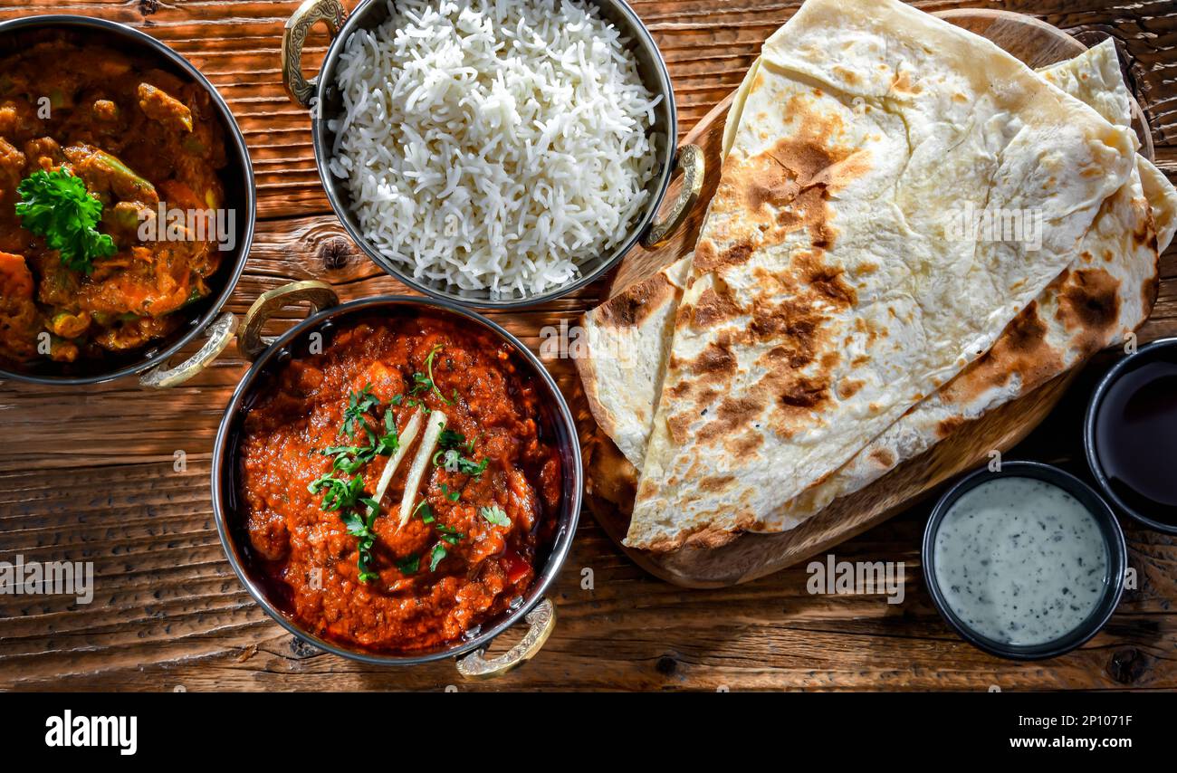 Hot madras paneer and vegetable masala with basmati rice served in
