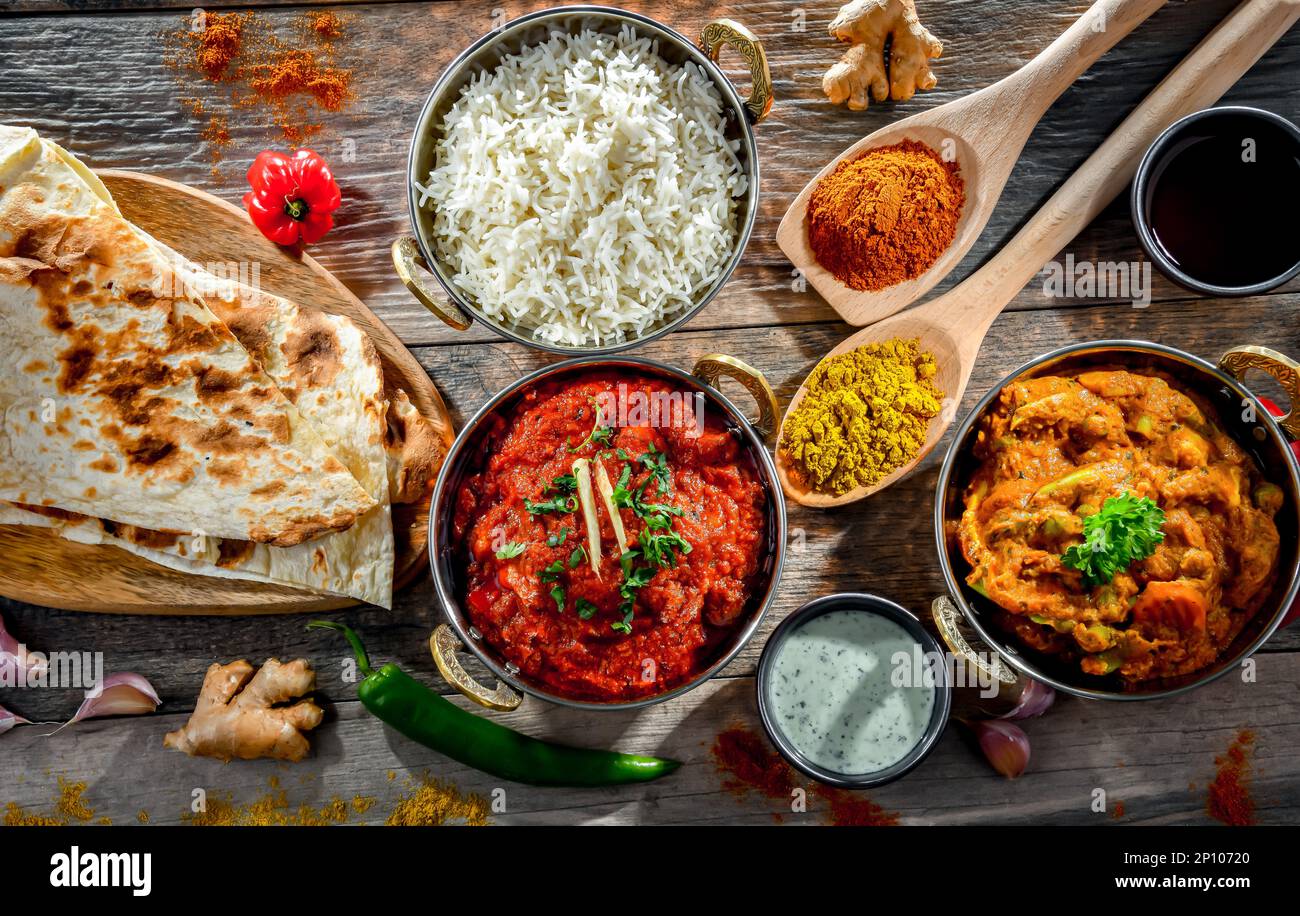 Hot madras paneer and vegetable masala with basmati rice served in