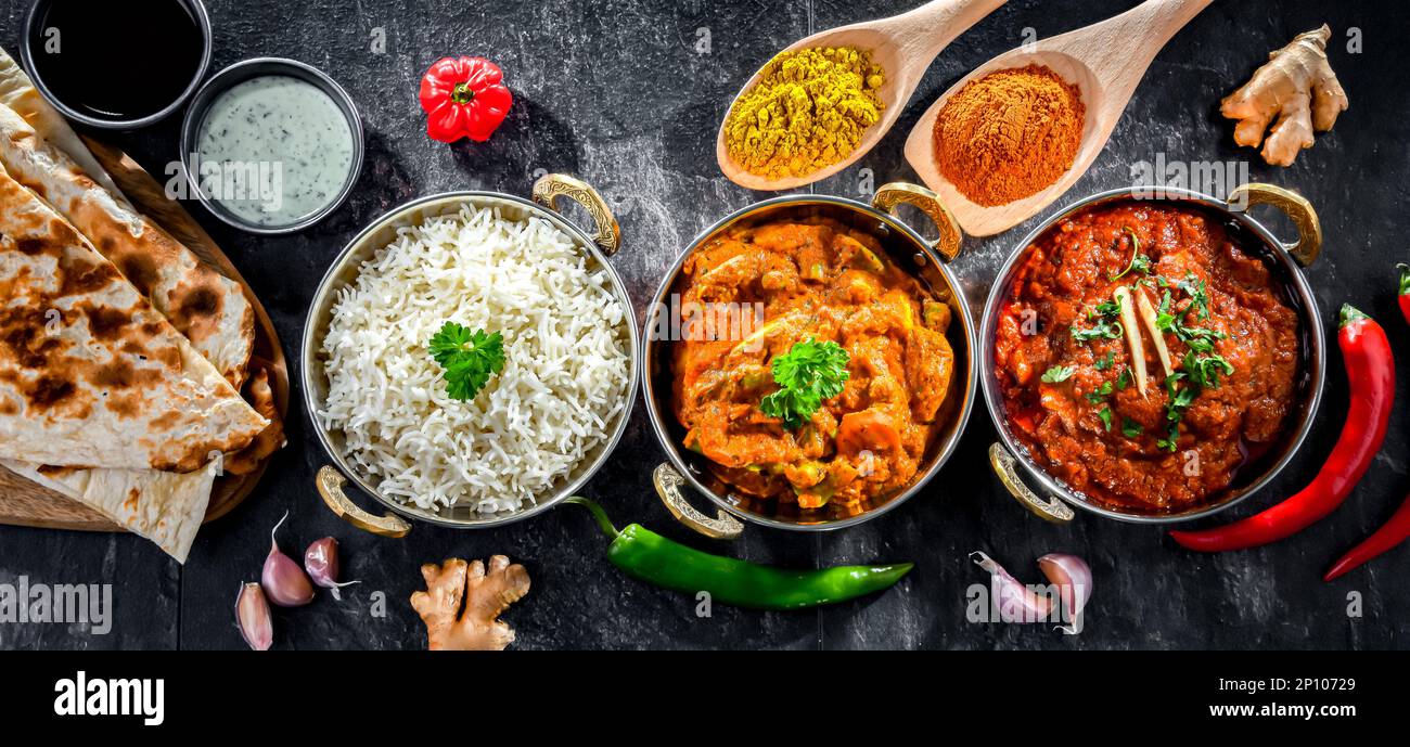 Hot madras paneer and vegetable masala with basmati rice served in