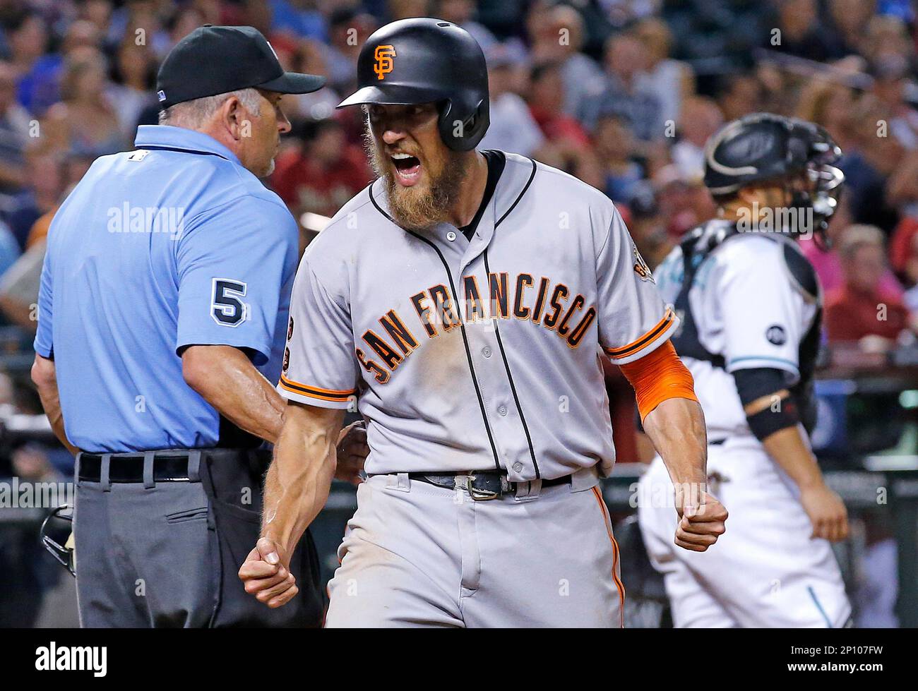 San Francisco Giants' Hunter Pence, middle, shouts in celebration after