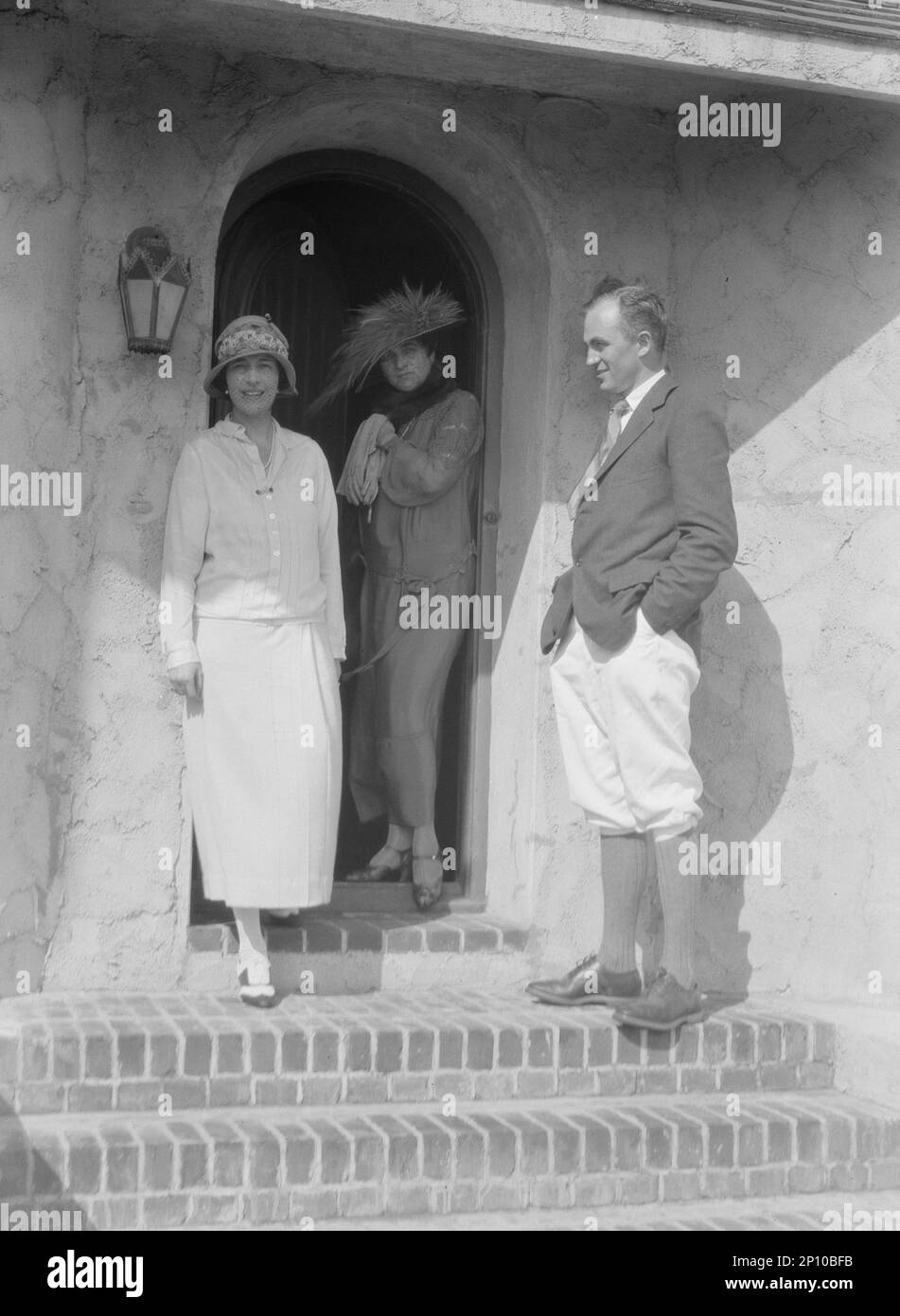 Slater, Mrs., and friends on the steps of a house in Long Beach, 1924 July. Stock Photo