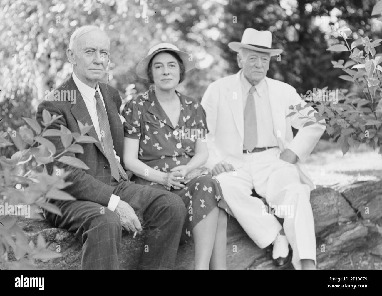 Timken, W.R., Mr. and Mrs., and John Hemming Fry, seated outdoors, 1938