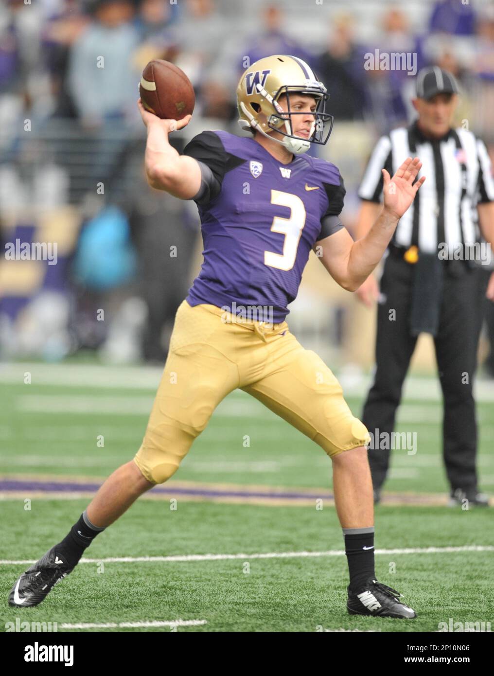 University of Washington quarterback Jake Browning (3) throws for a