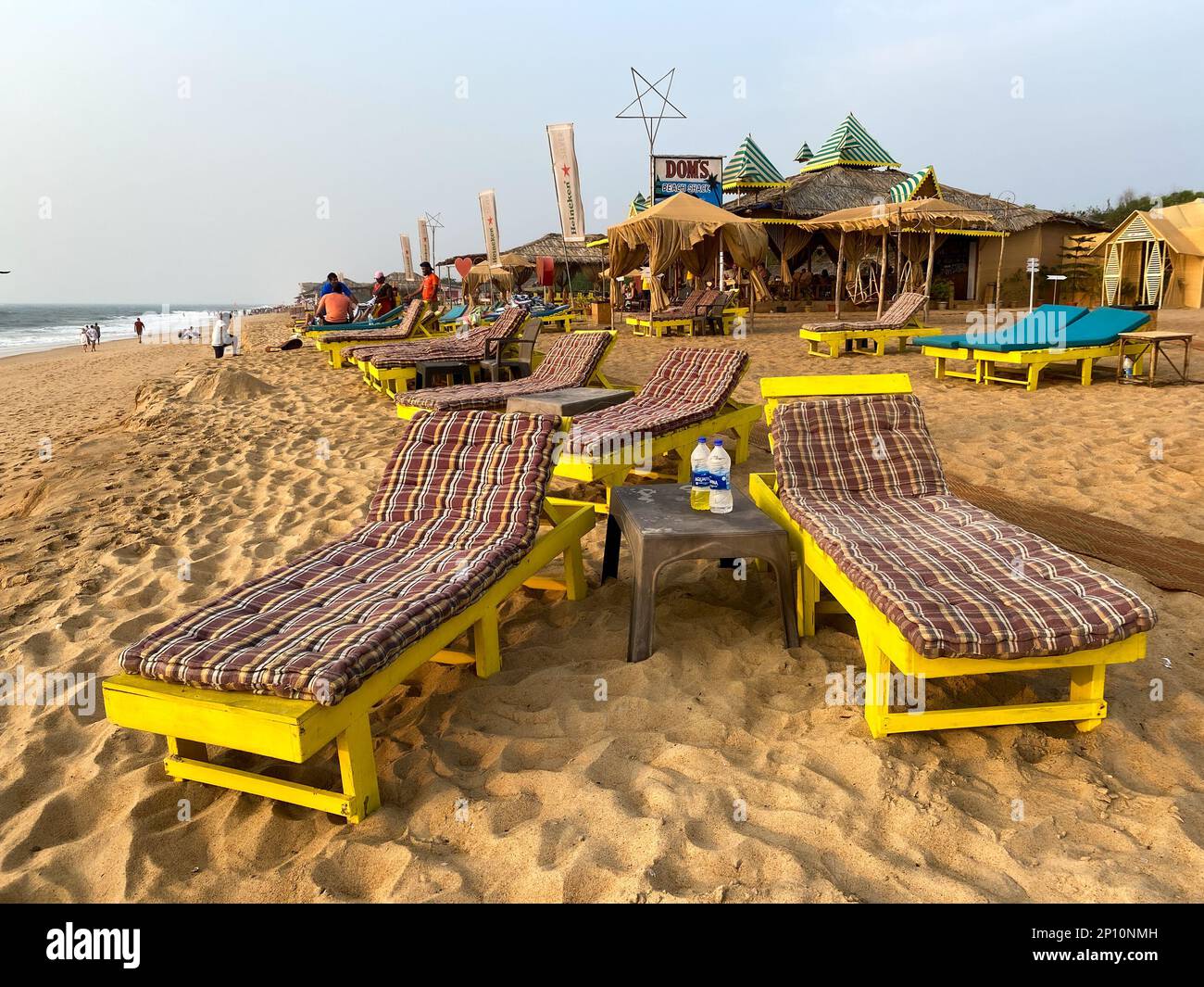 Candolim, Goa, India January 2023 Colorful sun beds outside a beach