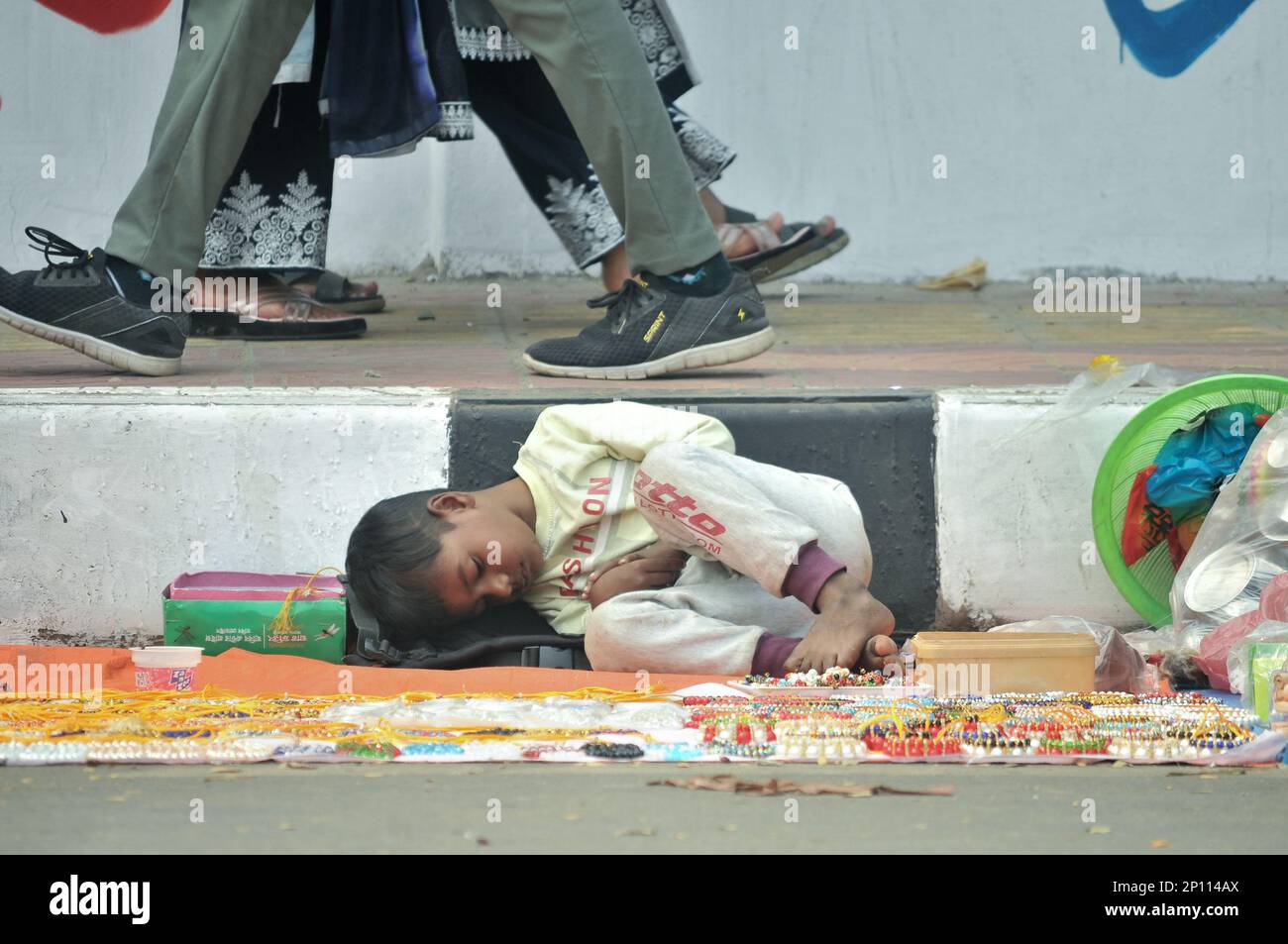 Street view in Dhaka, Bangladesh. Homeless people sleeping. Stock Photo