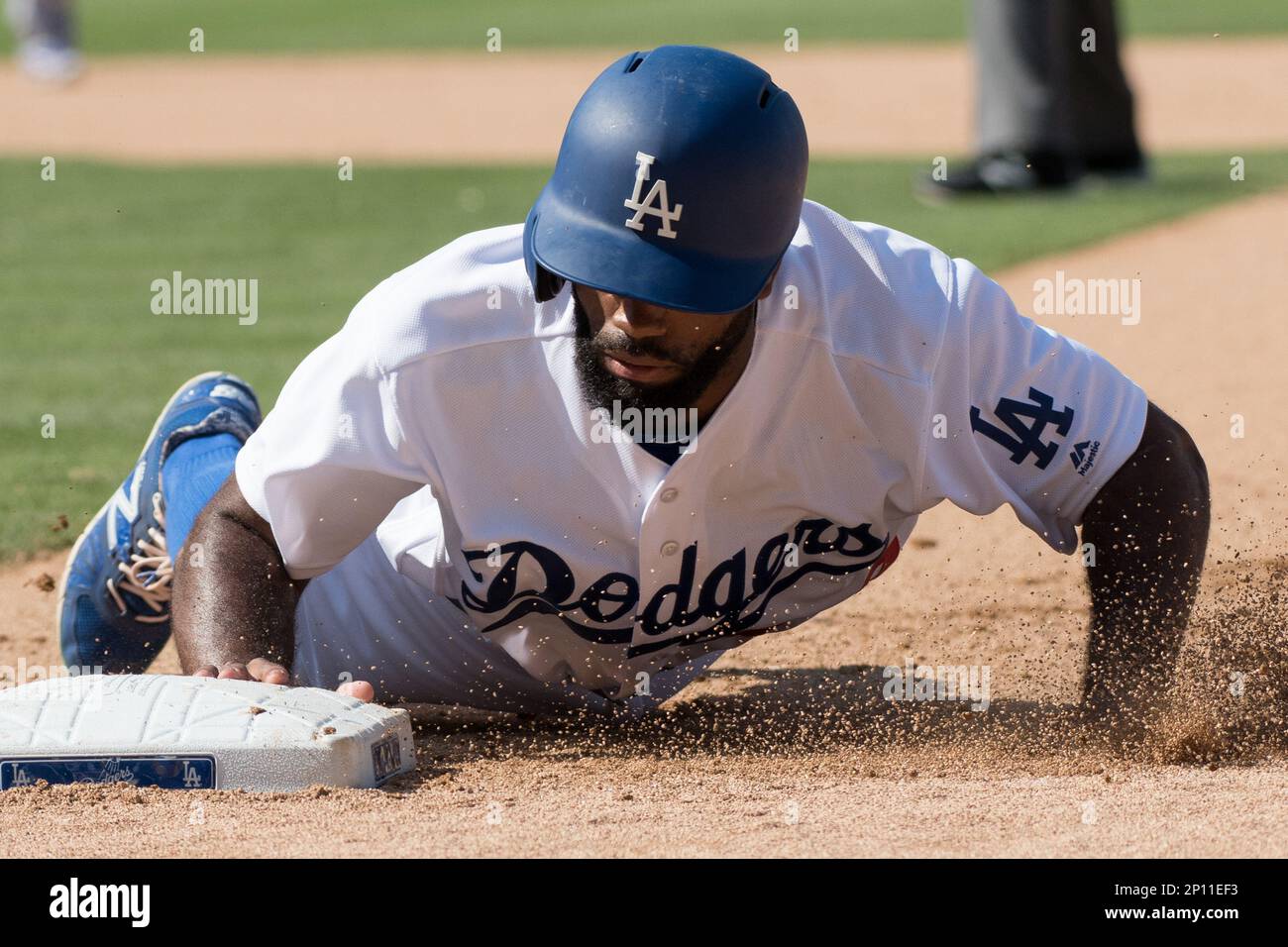 Los Angeles Dodgers' Andrew Toles (60) walks off the field after Game 1 of  the National League baseball championship series against the Chicago Cubs  Saturday, Oct. 15, 2016, in Chicago. Cubs won