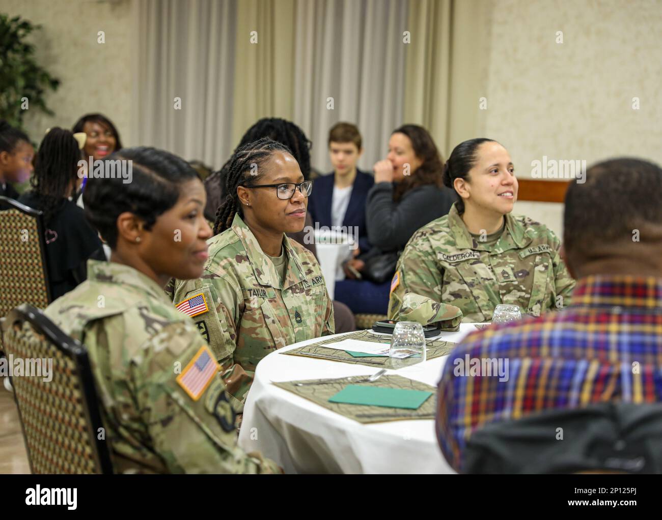 Soldiers station in Vicenza, Italy reflect on past injustices King fought during the civil rights movement during the Dr. Martin Luther King, Jr. prayer breakfast at Caserma Ederle. Stock Photo