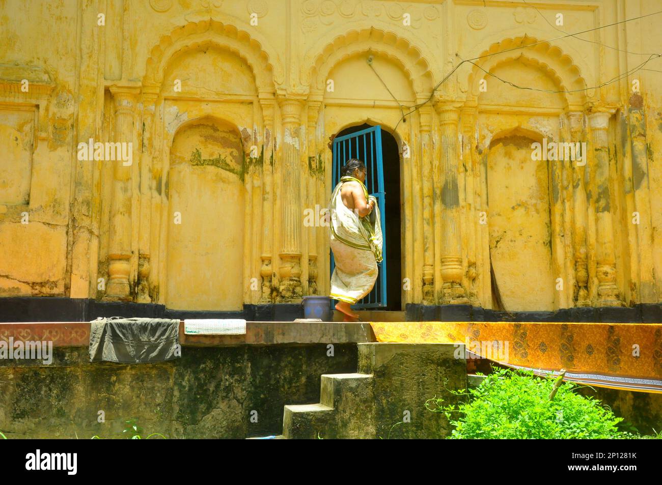 Picture of a vintage house and a poor girl in Faridpur, Bangladesh