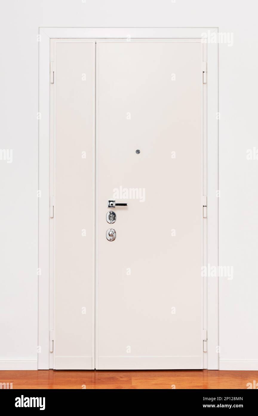 White armoured door of apartment on light parquet floor Stock Photo Alamy