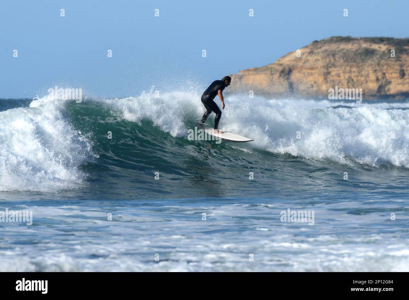 Surfing south side of Bells beach with cliff background near Torquay