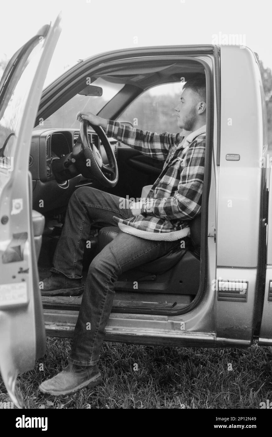 Man Sitting in Truck Stock Photo