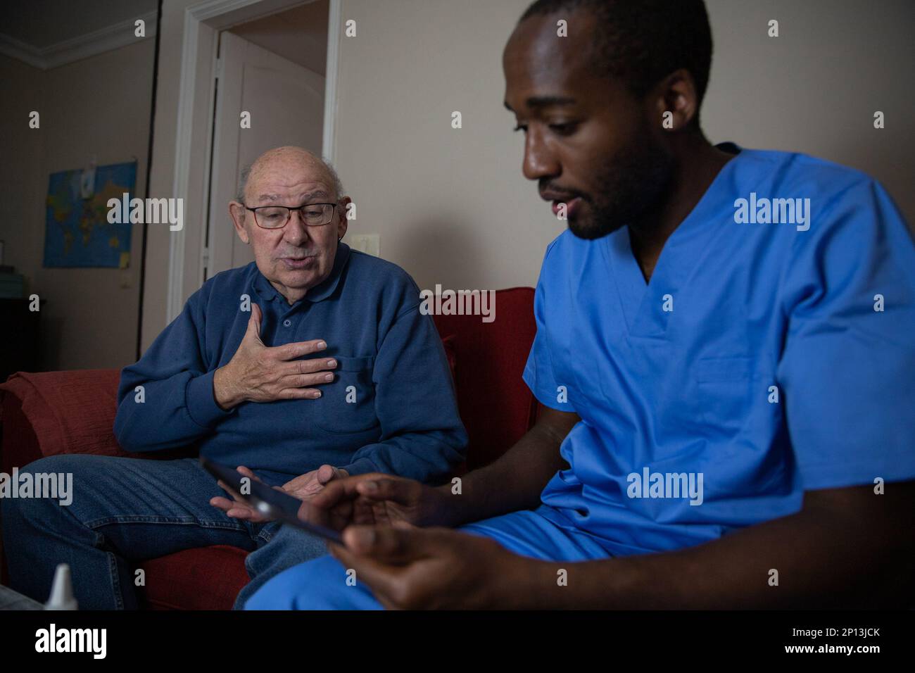 Care worker elderly patient african hi-res stock photography and images ...